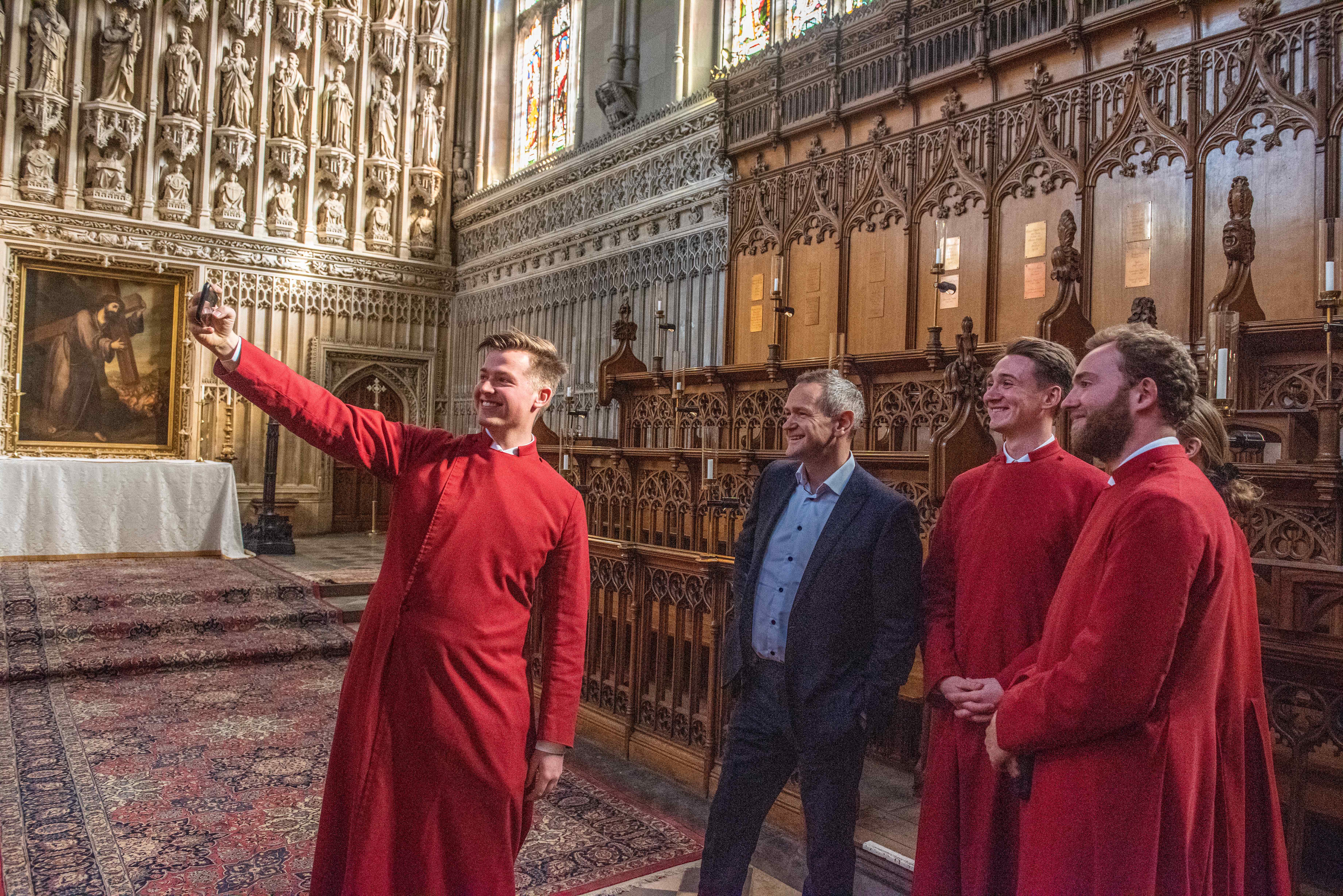 Choral scholars take a selfie with Alexander Armstrong