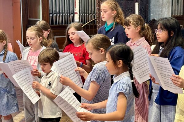 Children singing in a church
