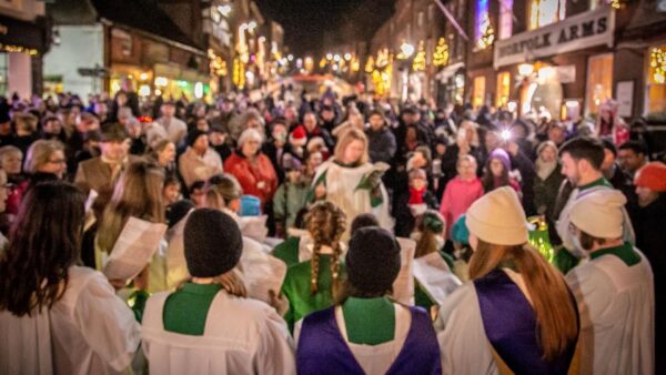 A choir singing outside at Christmas